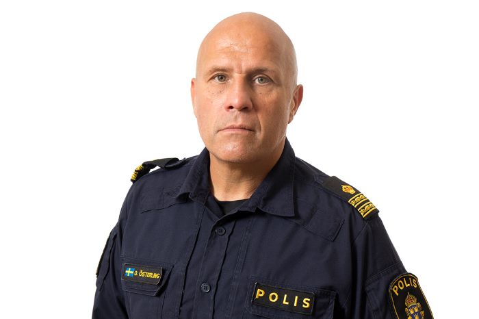 Porträtt. Man i polisuniform.