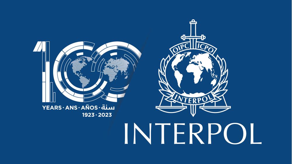 Interpol 100 år logga